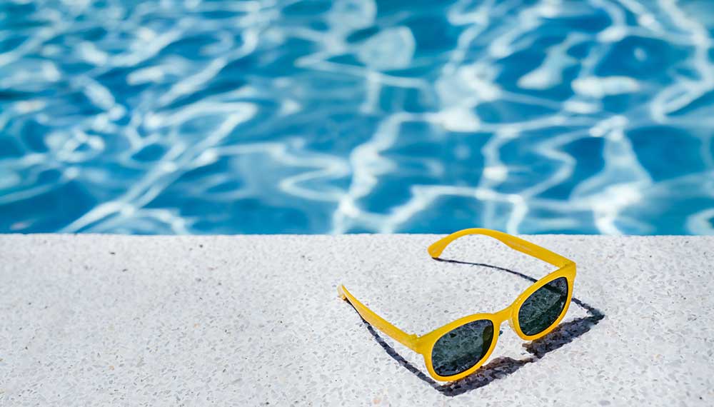 Sunglasses by pool