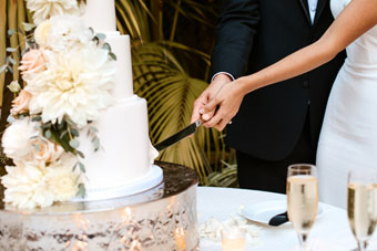 bride and groom cutting cake