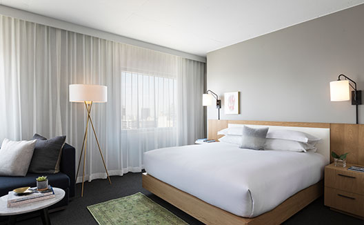 Suite king bed at Kimpton Everly Hotel